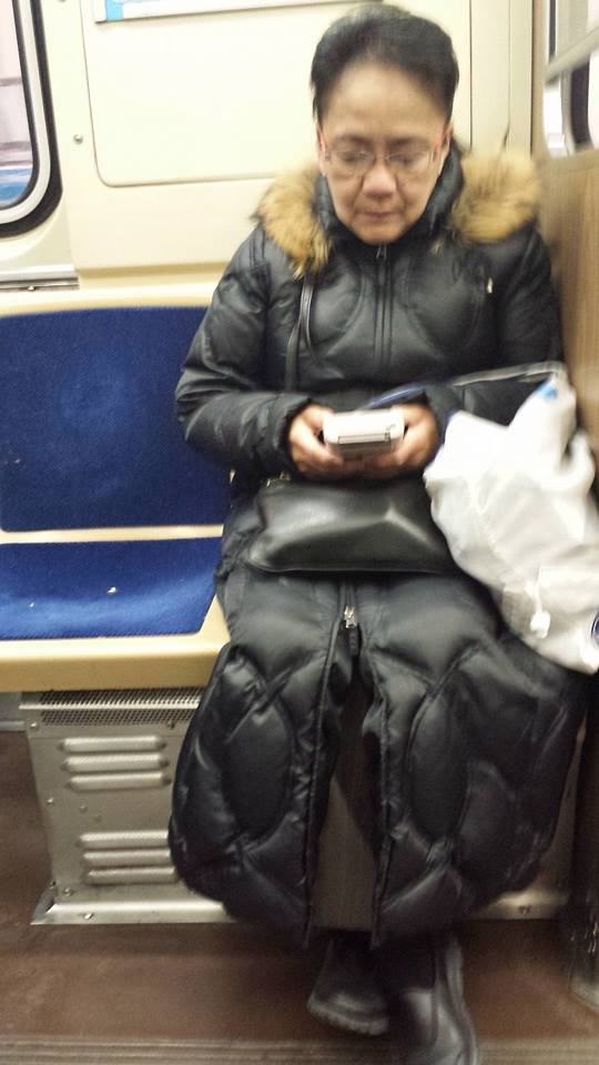 Older lady playing an OG Gameboy