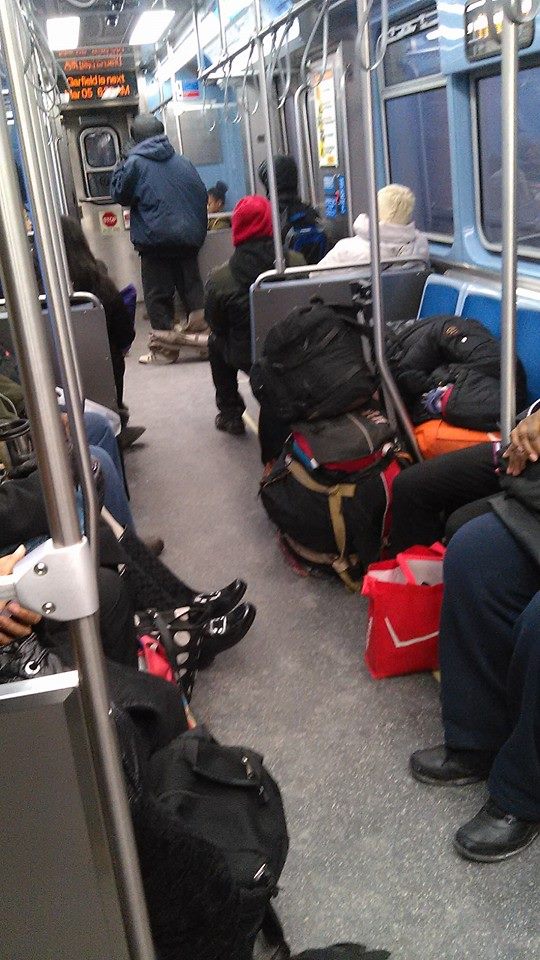 One person having a 4 seat slumber party and another guy with pants around his ankles.  Only in Chicago!